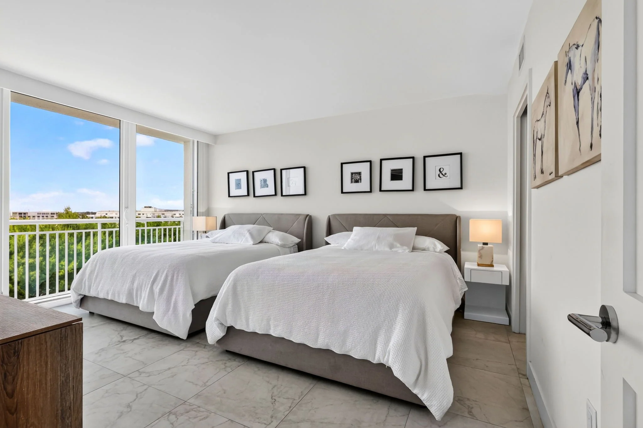 Oversized primary bedroom with balcony access