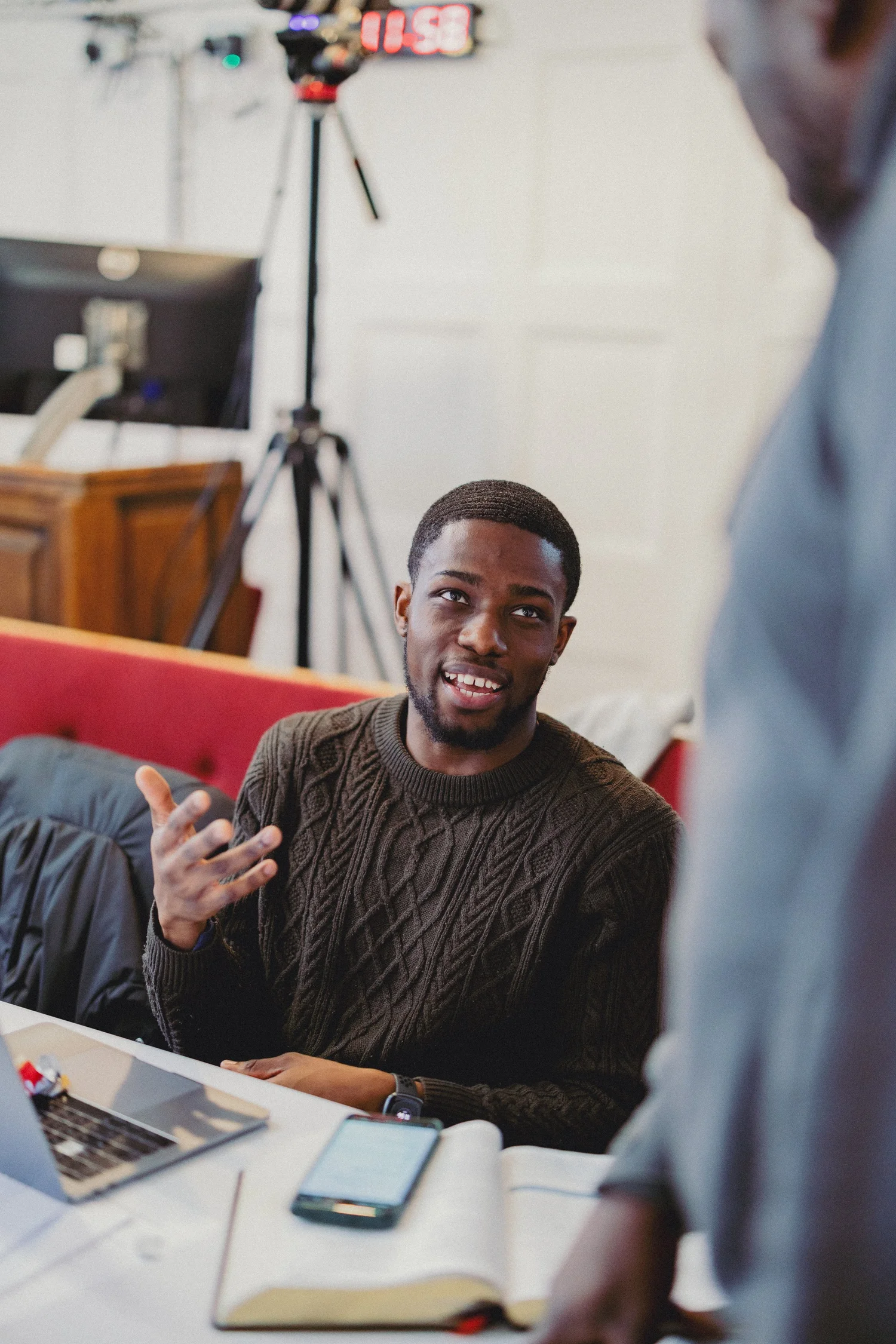 A young pastor asking a question in conversation