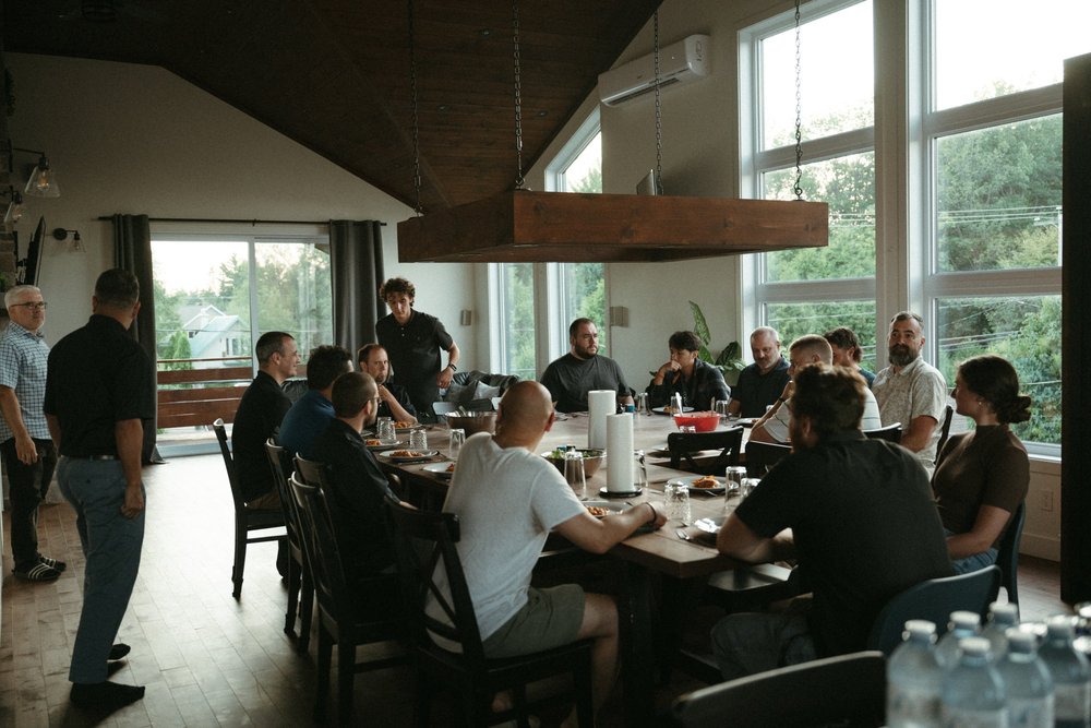 Church leaders gathered around a long dinner table