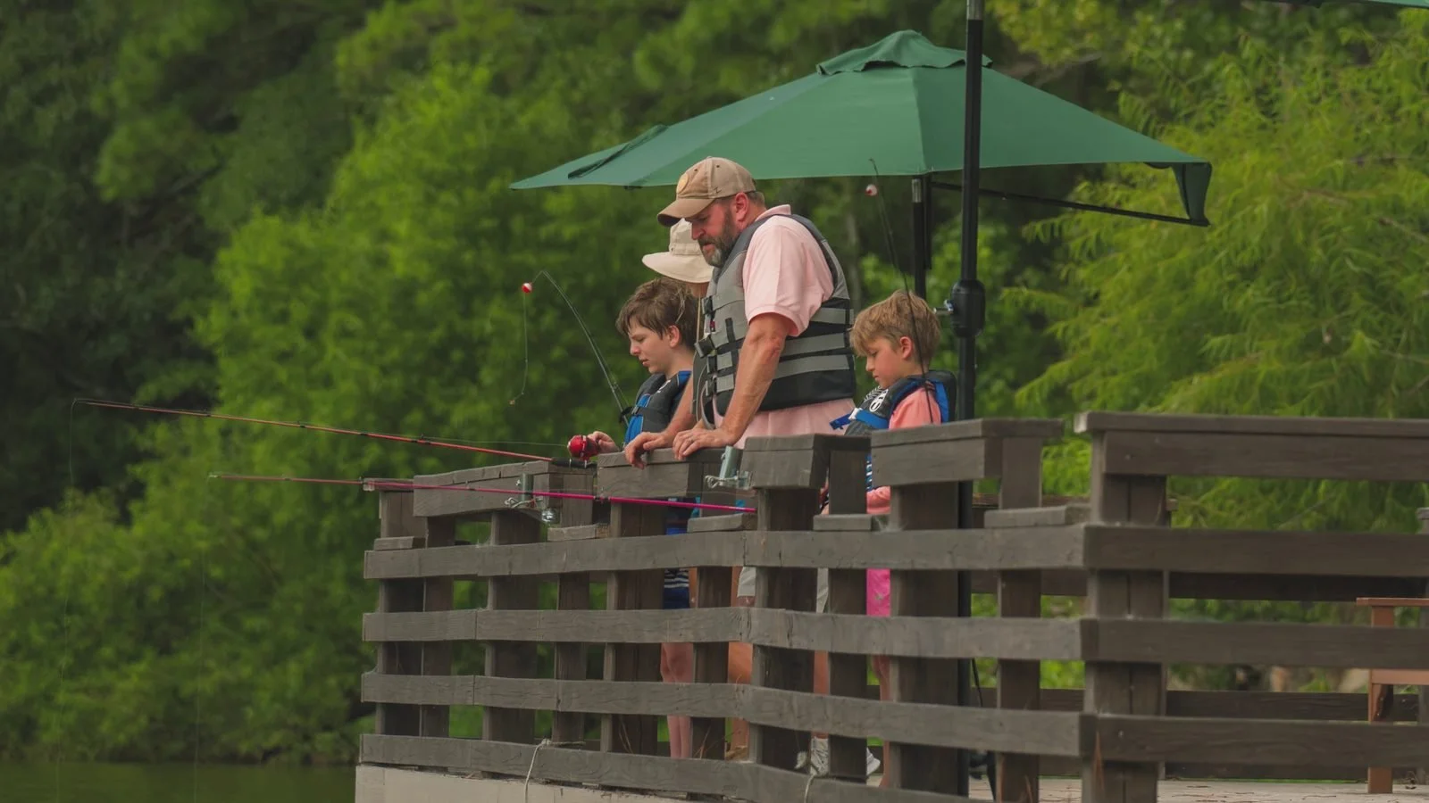 A family fishing together at Camp Cole