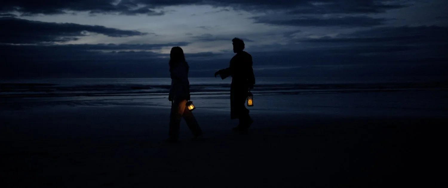 Two figures on a rocky coast in The Lost Jedi