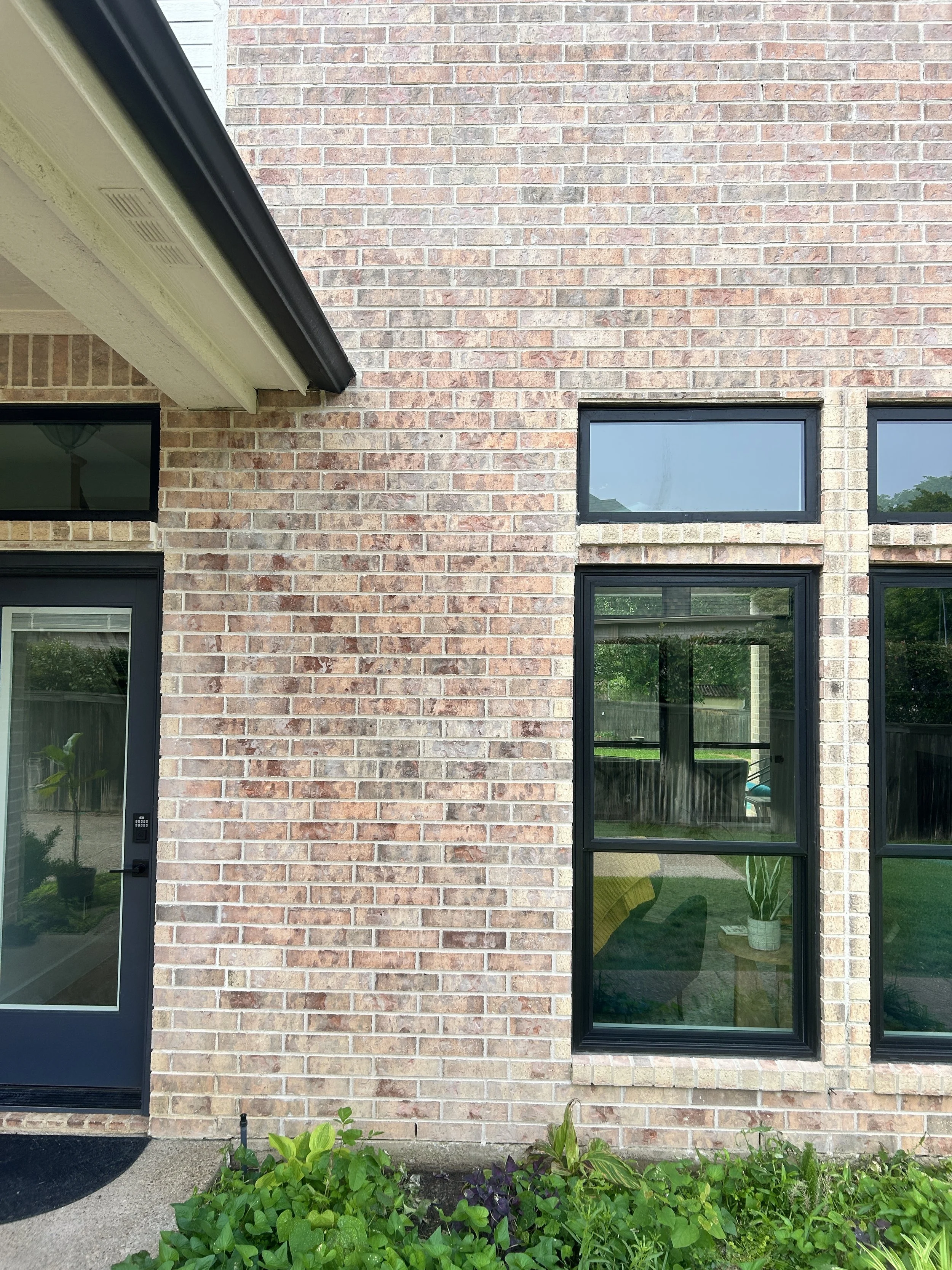 Repointed mortar joints beside windows on a Southlake Texas brick home