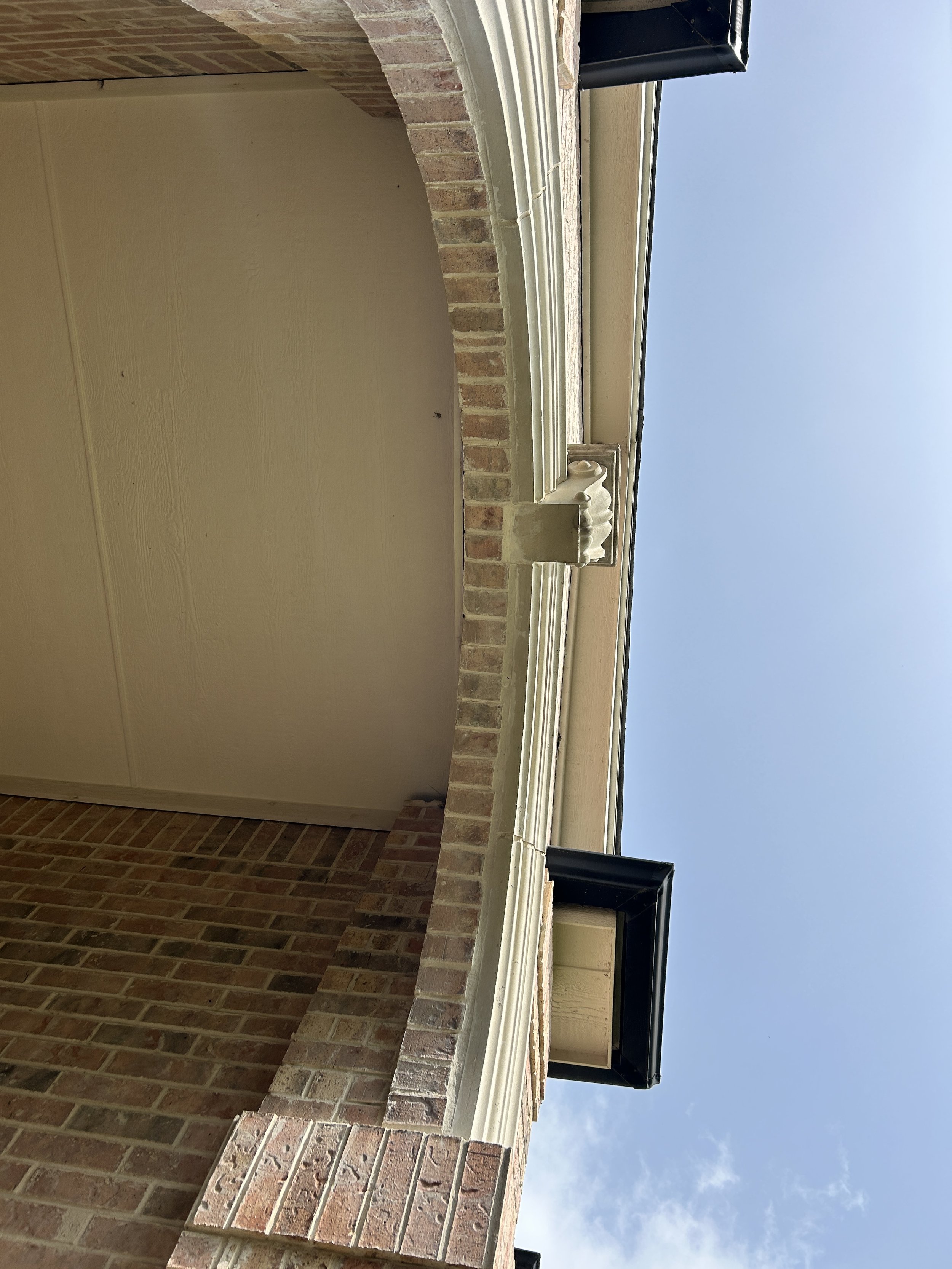 Mortar repointing around upper architectural brickwork on a Southlake Texas home
