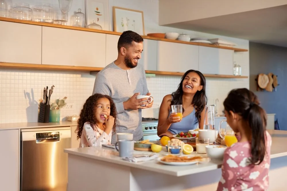 Family enjoying breakfast together at home