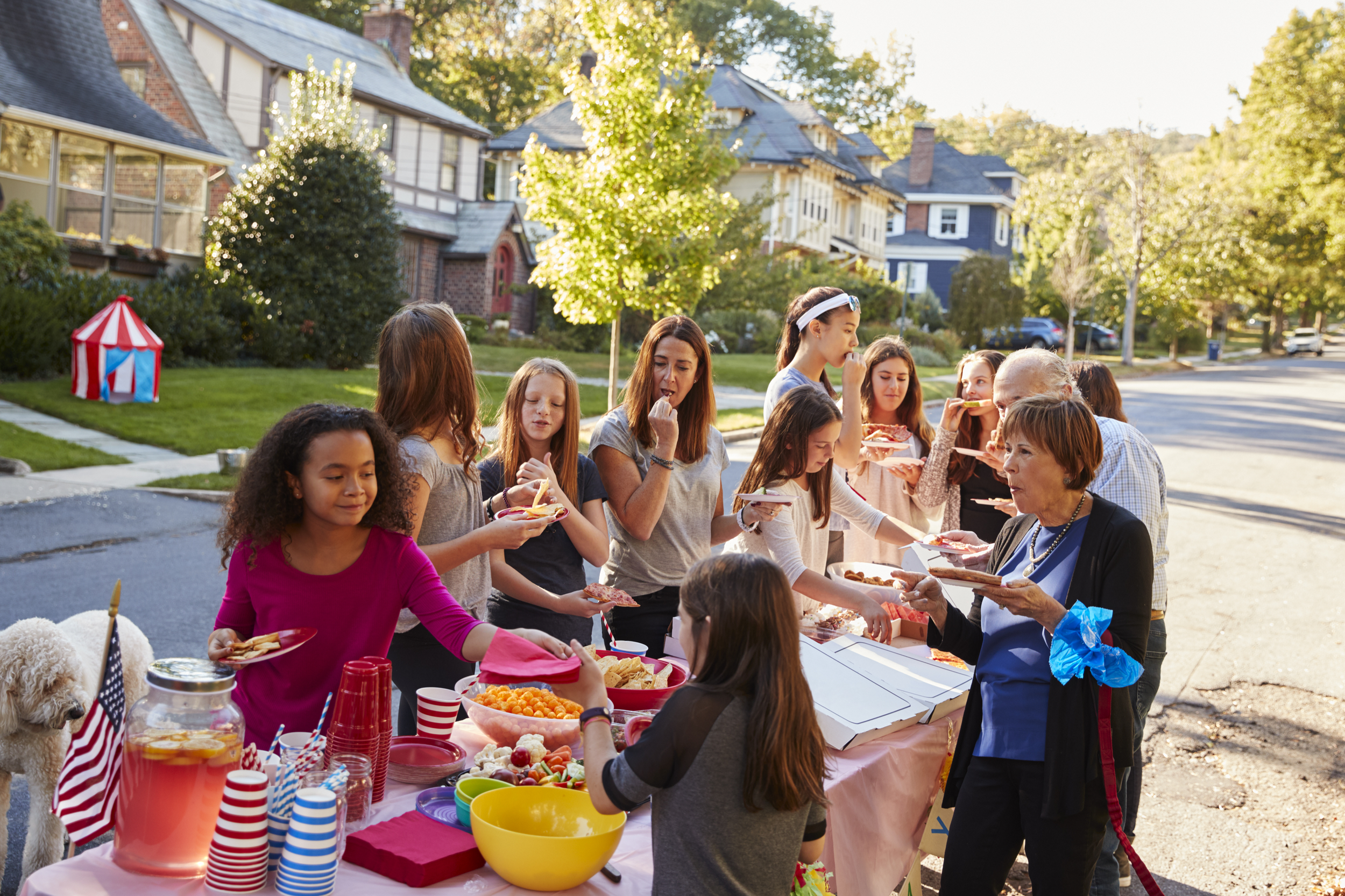 Neighbors sharing food at a community gathering