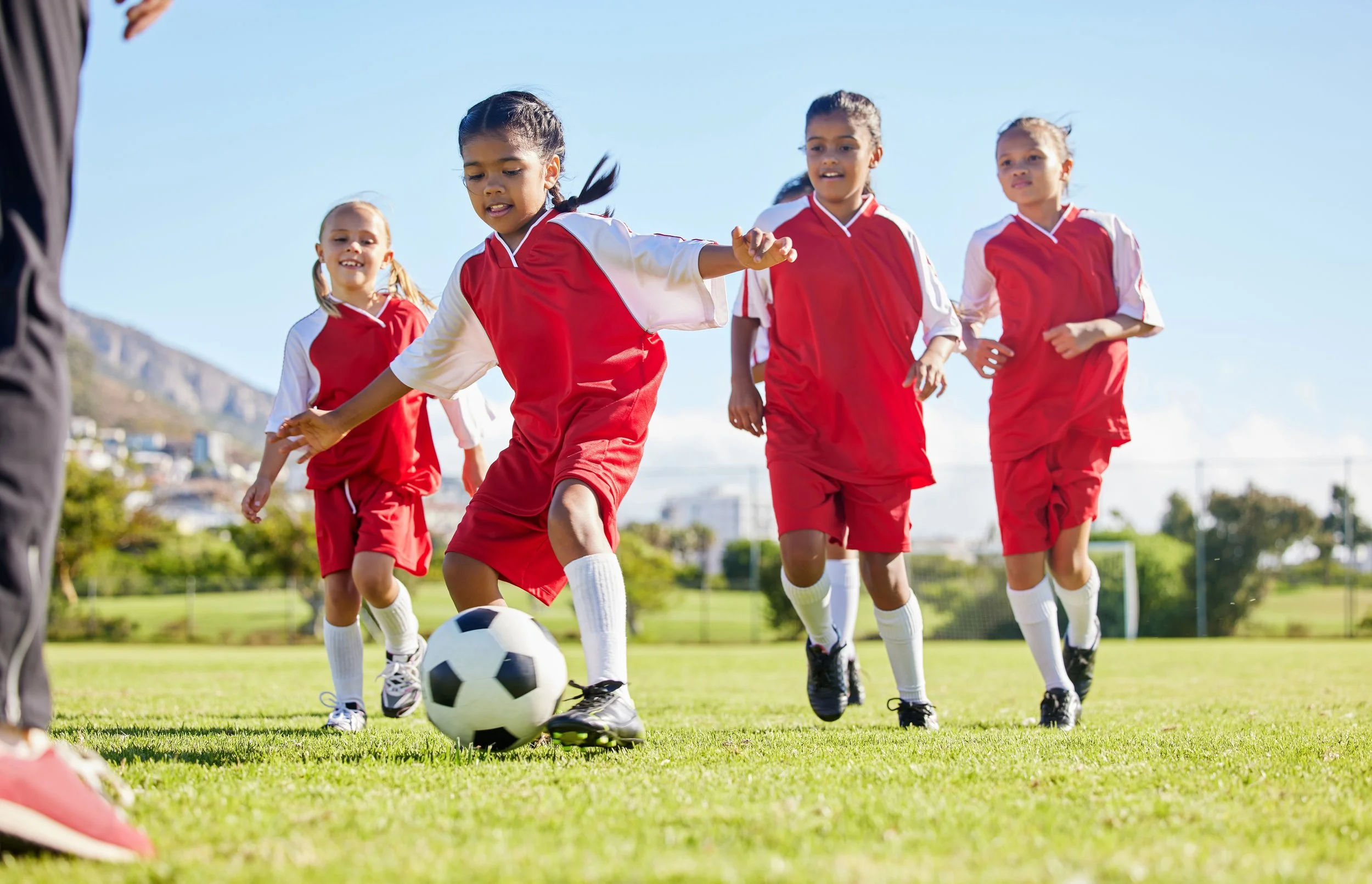Young soccer players practicing together outdoors