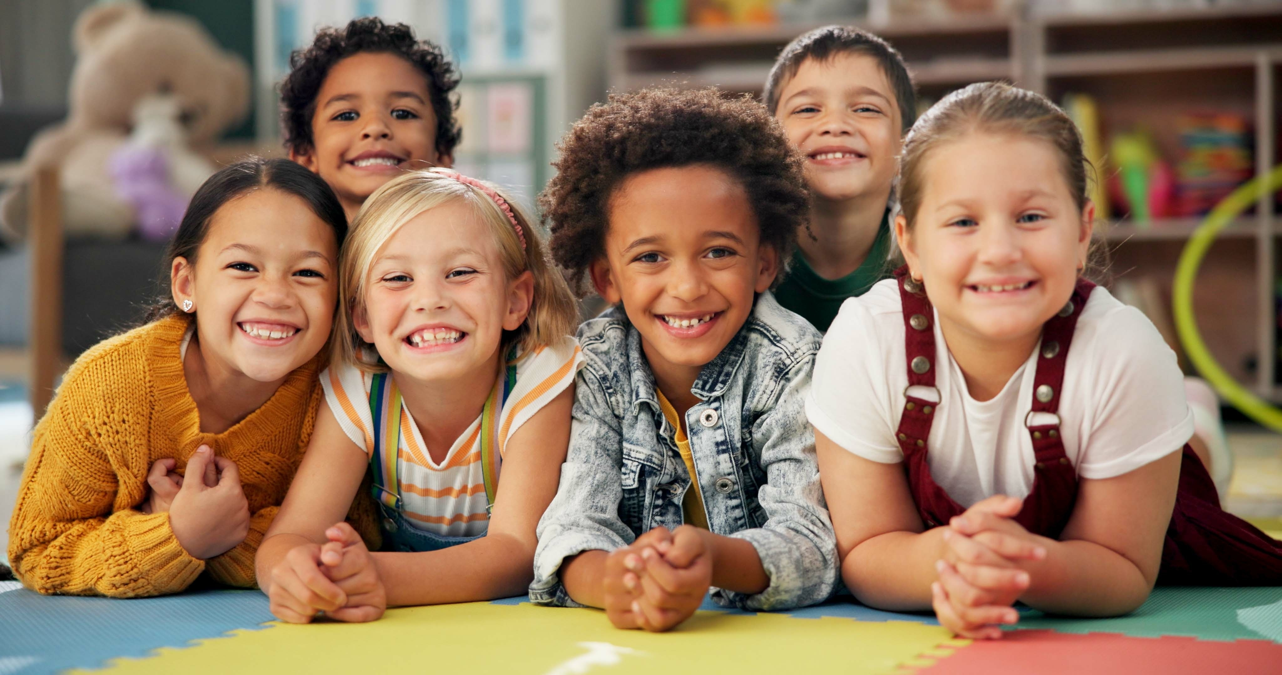 Children smiling together during a school project