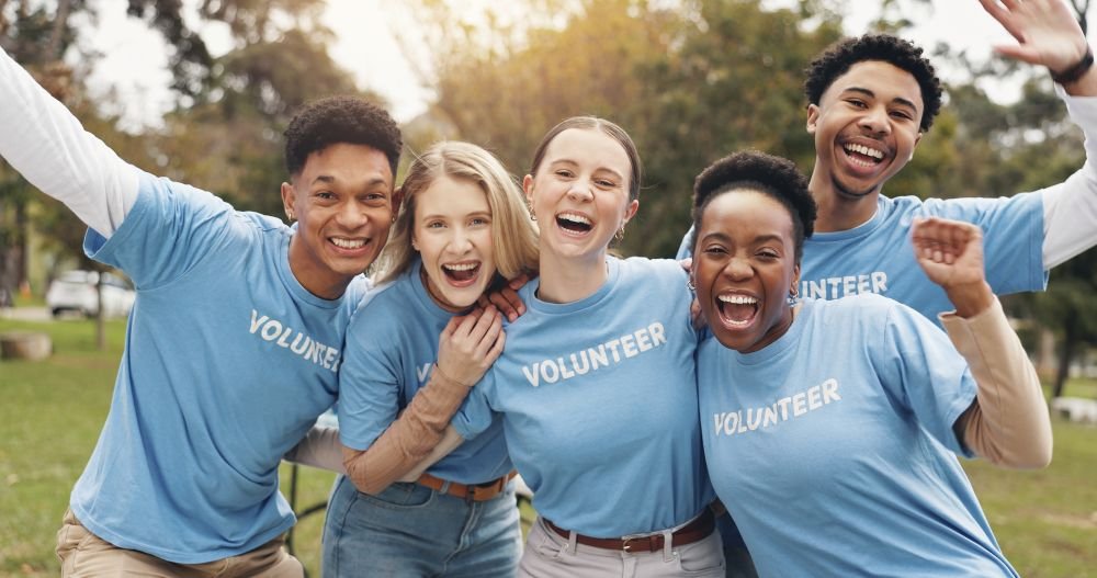Volunteers celebrating together outdoors