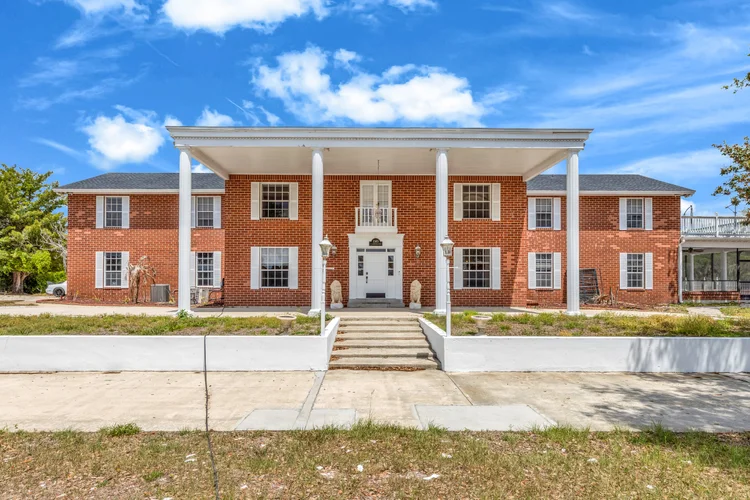 Front exterior of a brick colonial-style home