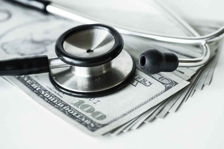 Dollar bills with a surgical mask, gloves and medicines