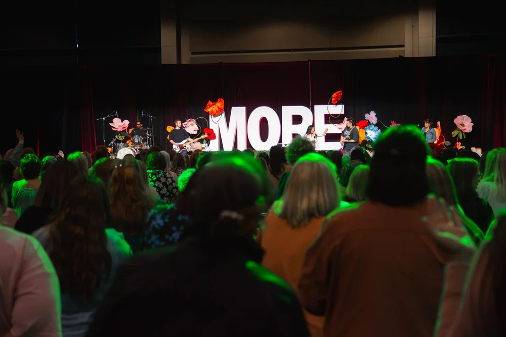 Attendees worshipping during the MORE Conference