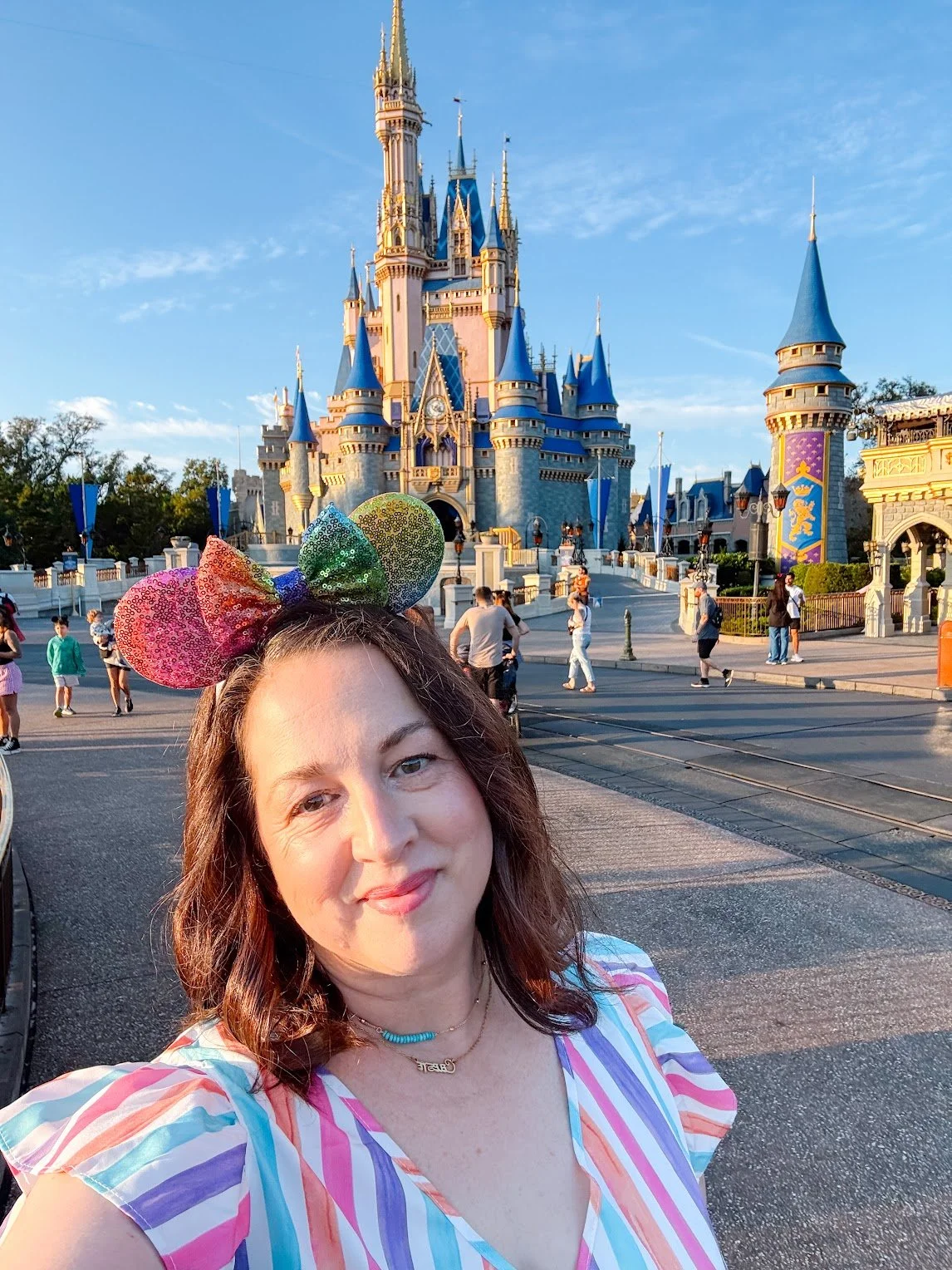 Travel advisor Celeste Woodside in front of Cinderella Castle at Walt Disney World