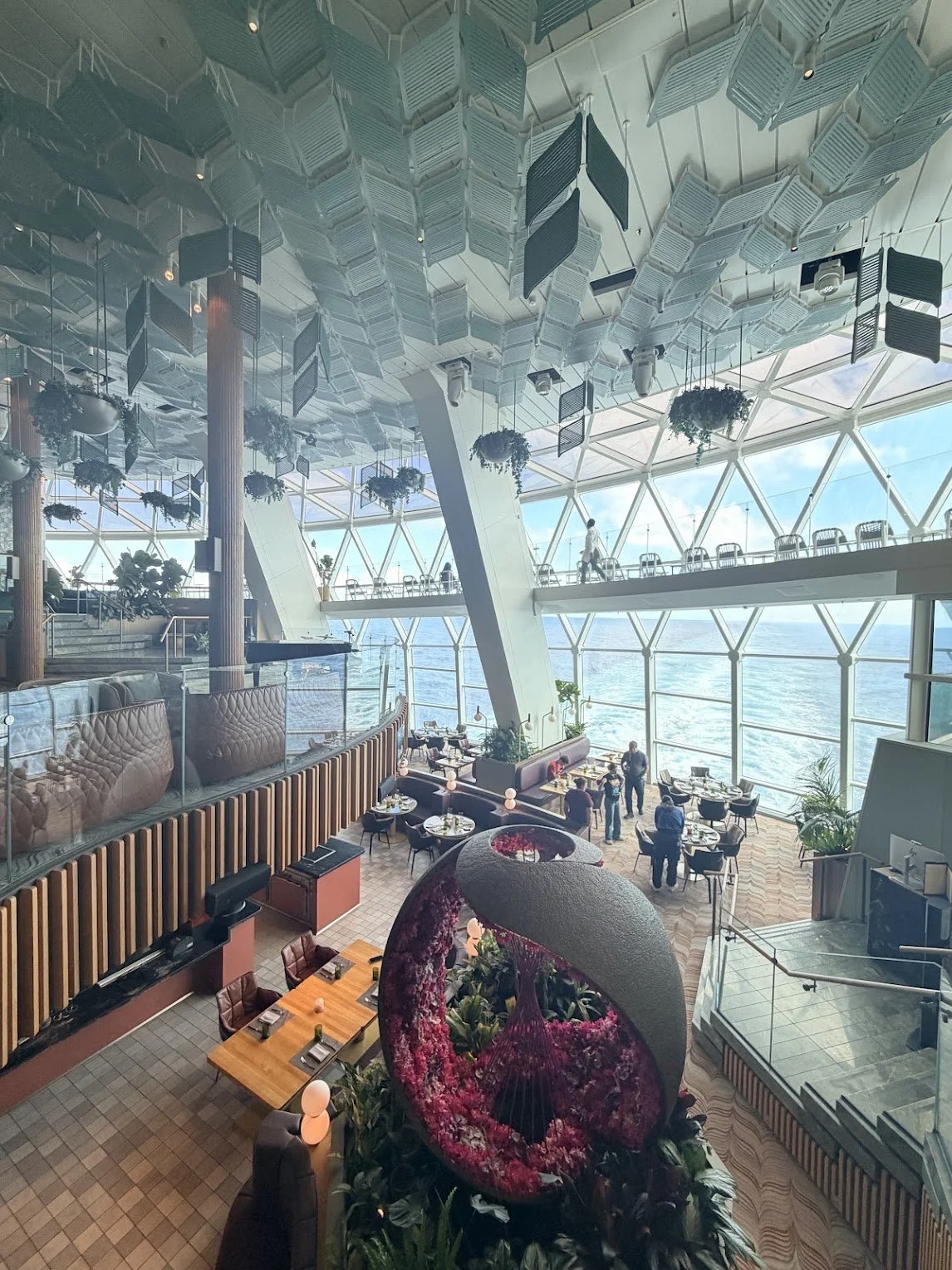 Eden aboard Celebrity Beyond, with floor-to-ceiling windows overlooking the sea