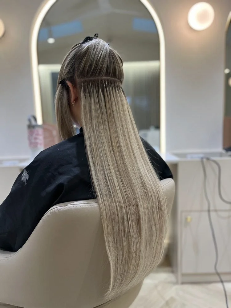 Invisible keratin bonds from behind, in the salon chair