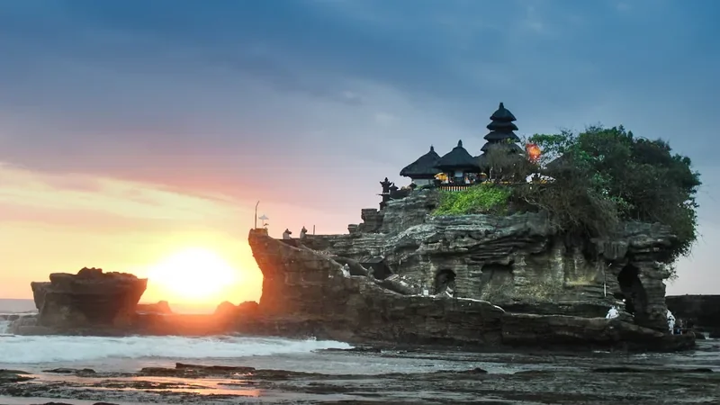 Tanah Lot sea temple at sunset with dramatic sky in Bali