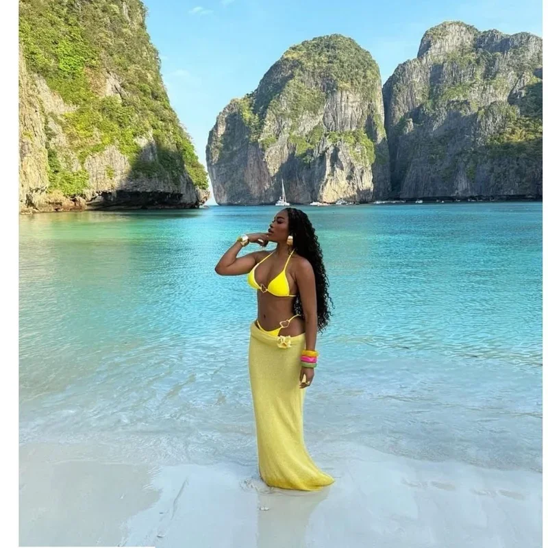 Woman in yellow dress at Maya Bay, Thailand — a Destinationz client