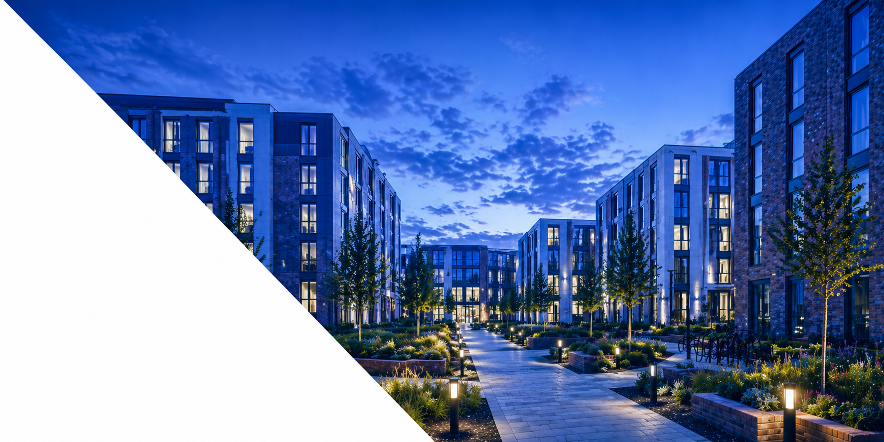 Purpose-built student accommodation at dusk — every lit window is energy being paid for