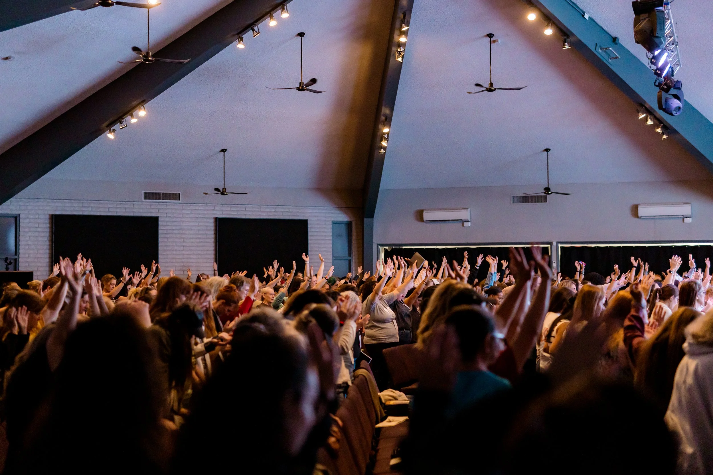 Women gathered around picnic tables at fall retreat