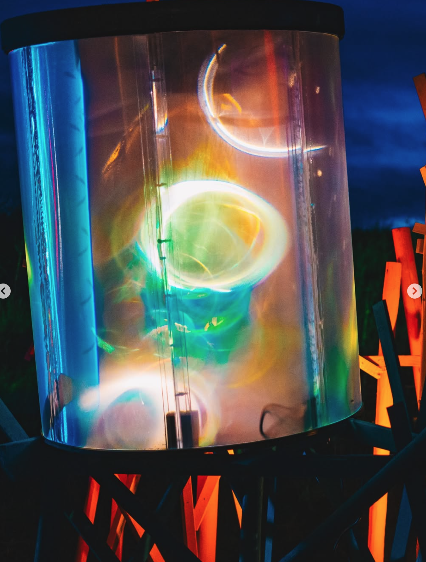 Nebula — coloured reflections through the transparent cylindrical panels