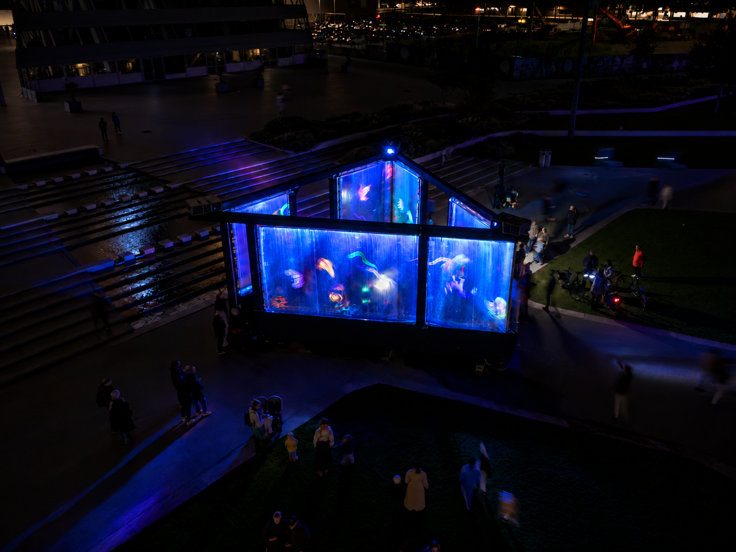 Watercolour Interactive at Alluminous — aerial view of the illuminated water installation and visitors