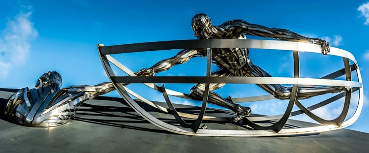 artwork of a man reaching down to help another man