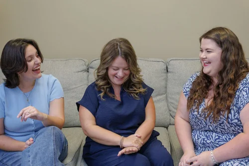 Sycamore counselors sharing a laugh in the office