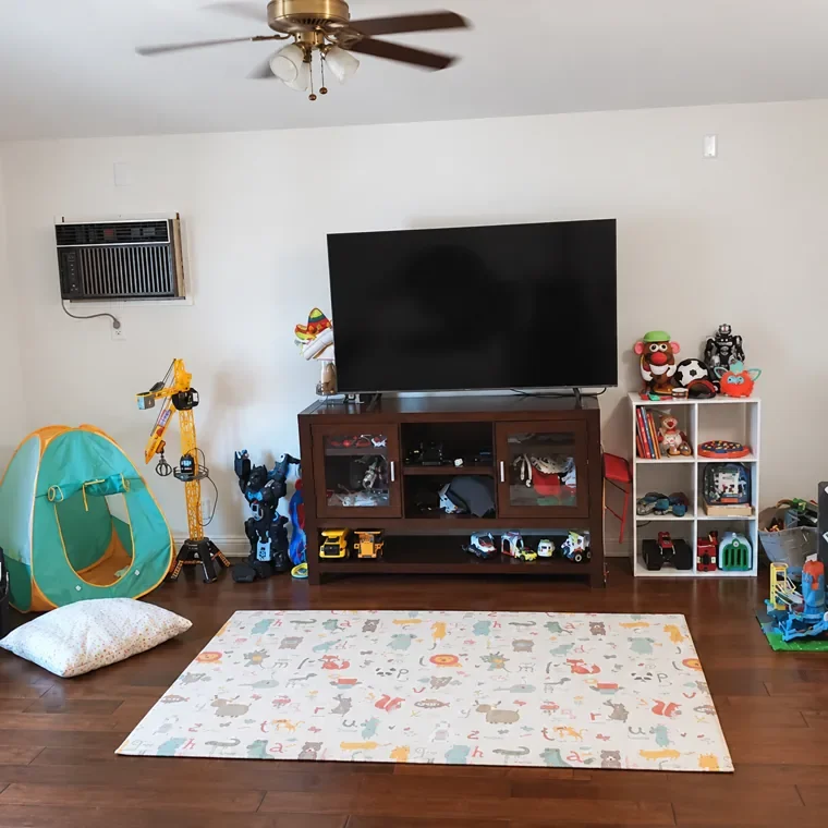 After: defined guest and play areas with storage for easier upkeep.