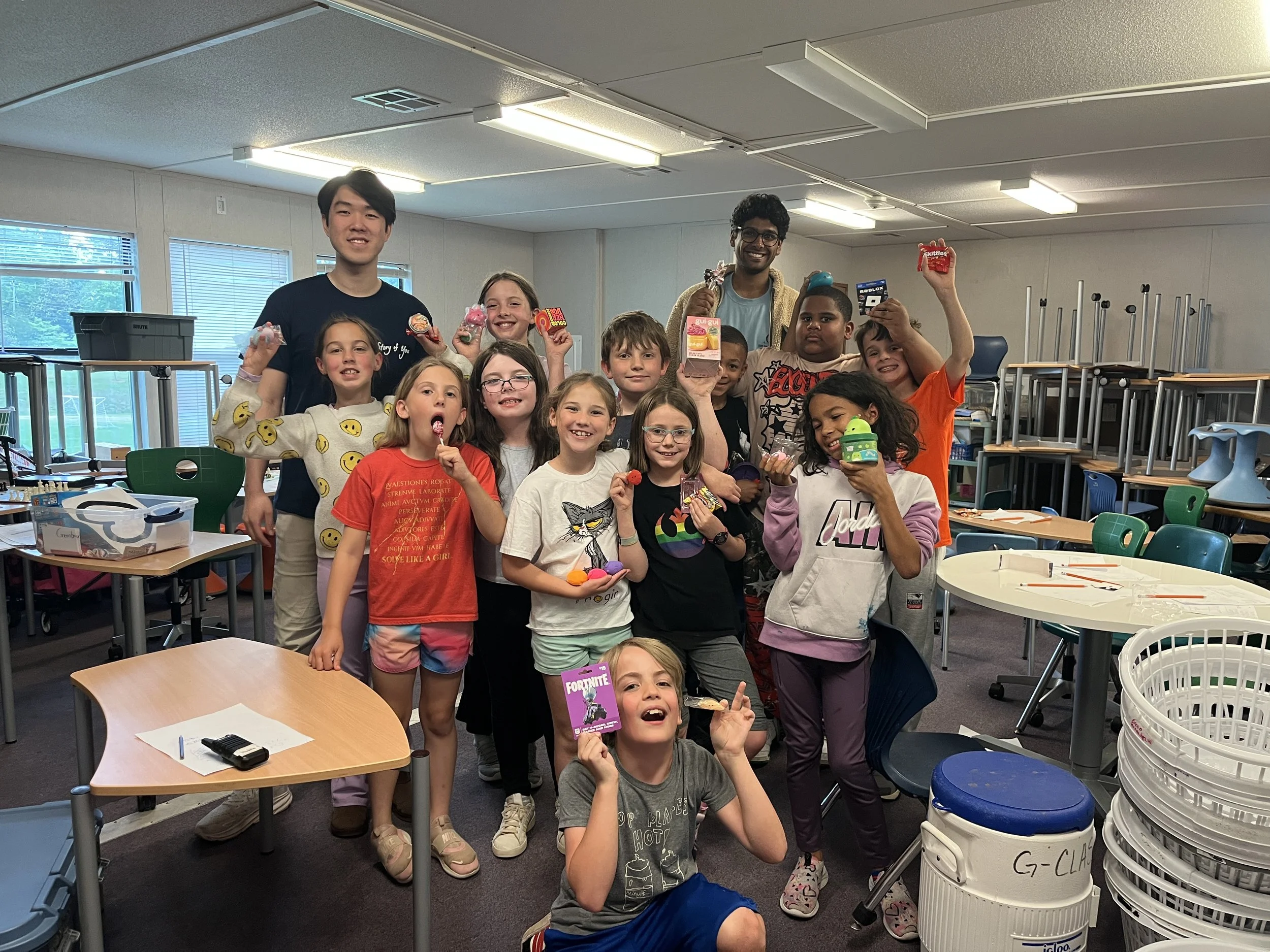 Students and Story of You coaches celebrating with their prizes during Math 24 Month