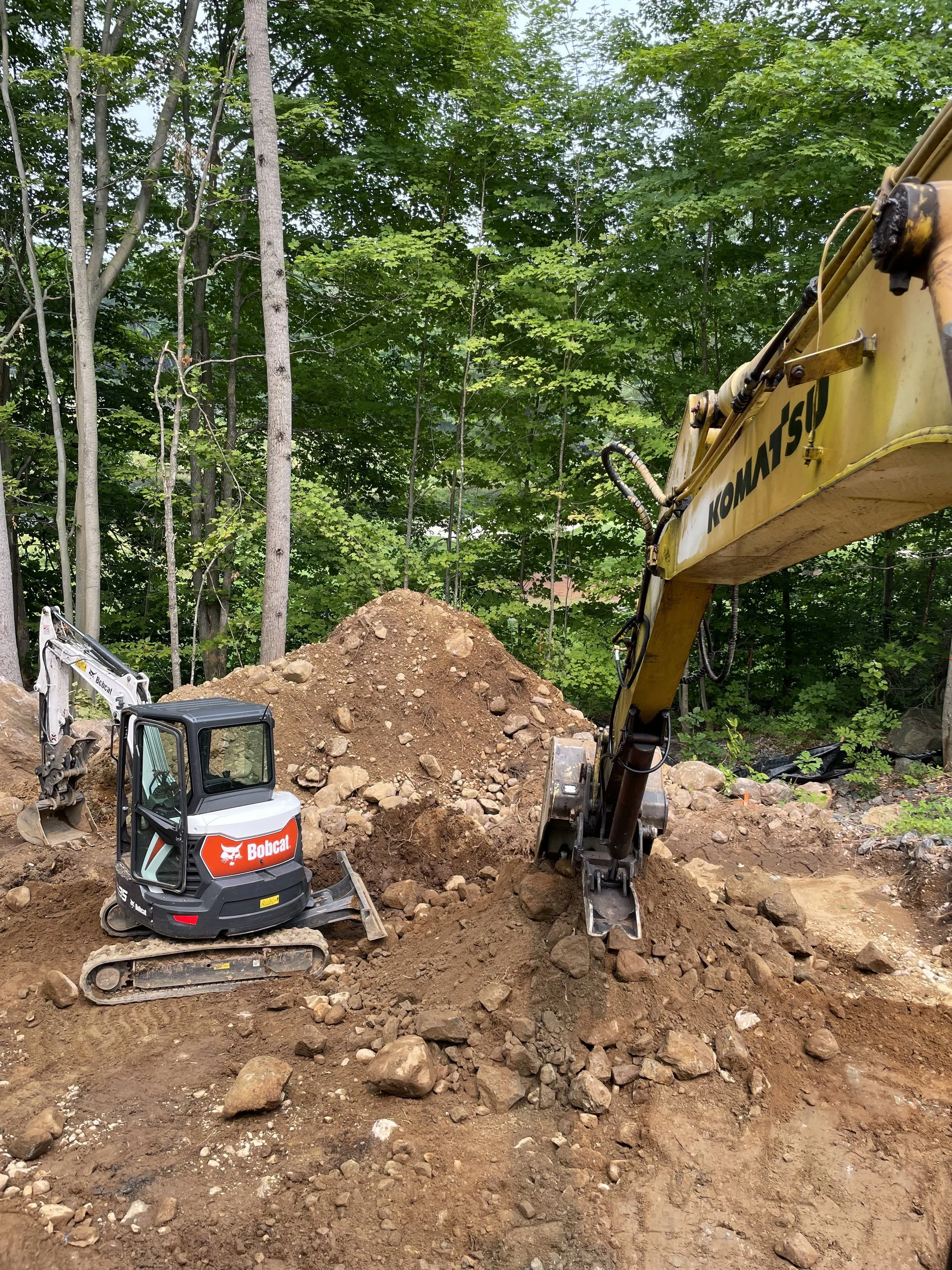 Land development with heavy equipment on a Muskoka site