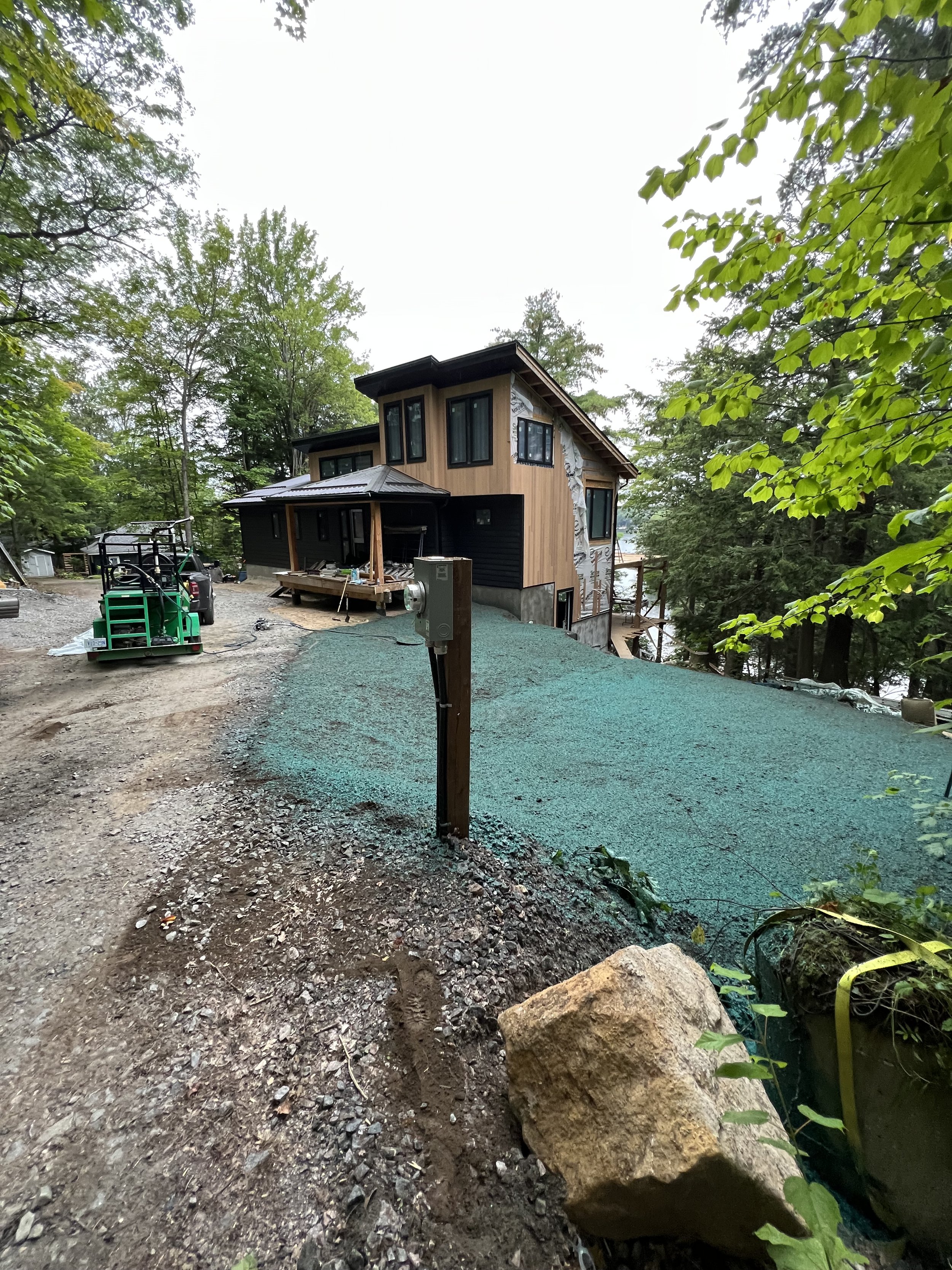 Hydroseeding applied over a newly completed septic and graded site in Muskoka
