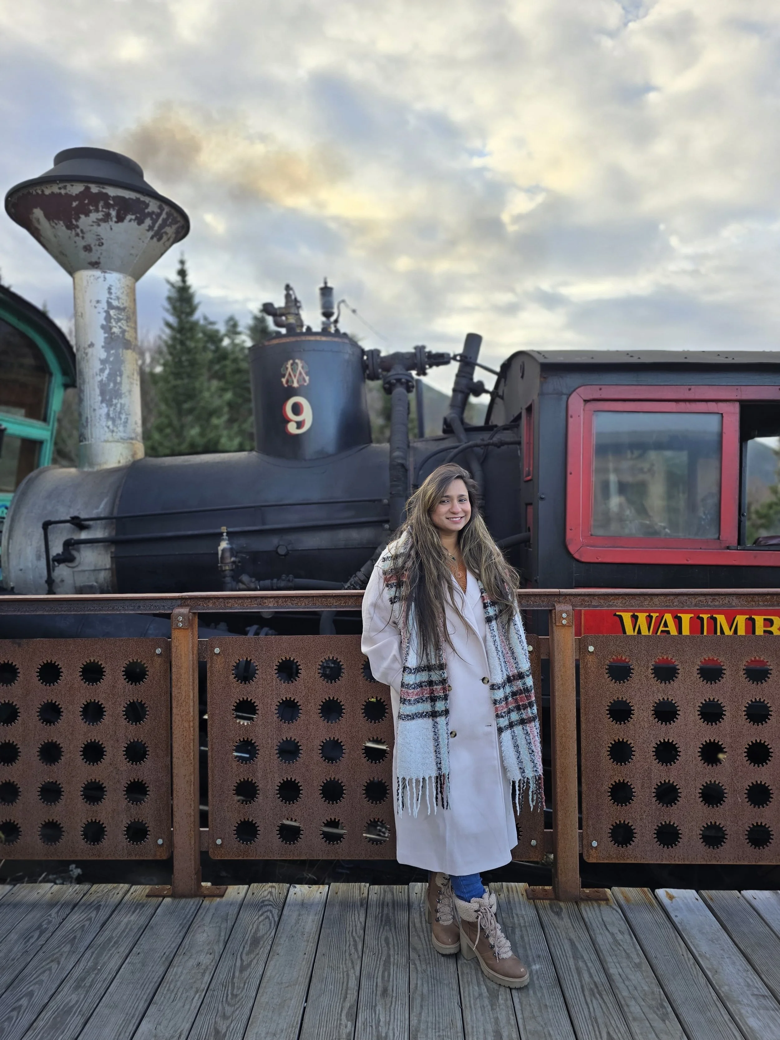 Manisha on a scenic road background