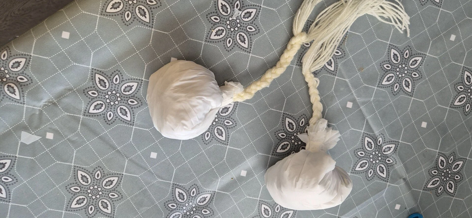 Handmade poi with braided cords.