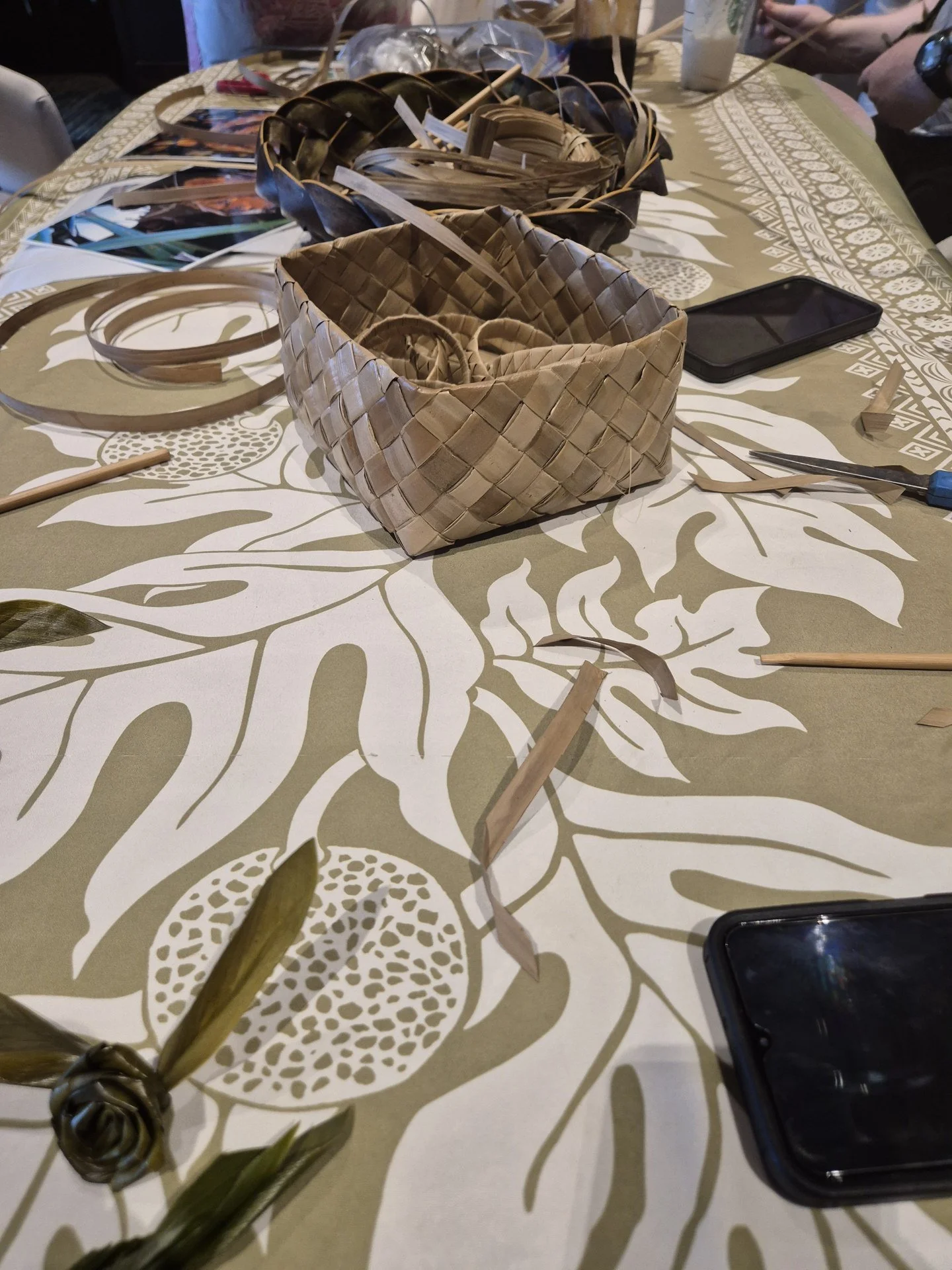 Basket and natural fibres prepared for a weaving workshop.