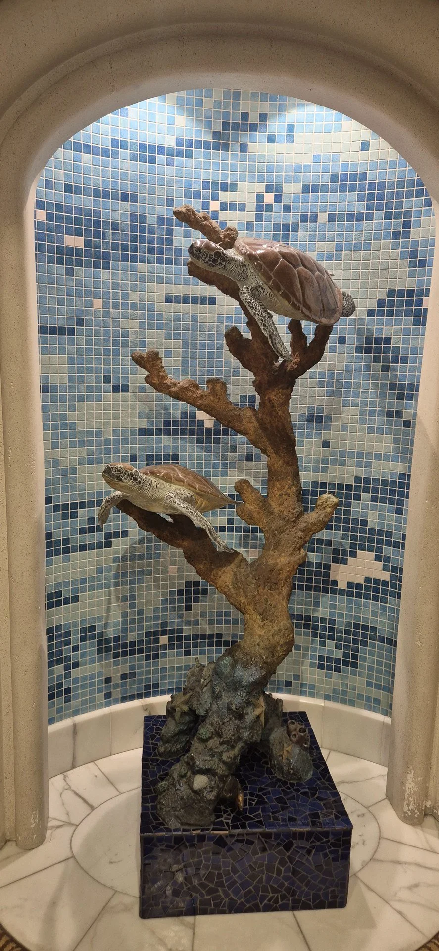 Colourful mosaic artwork beside a cruise ship pool.