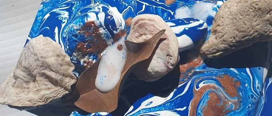 Decorated shells and colourful handmade art pieces.