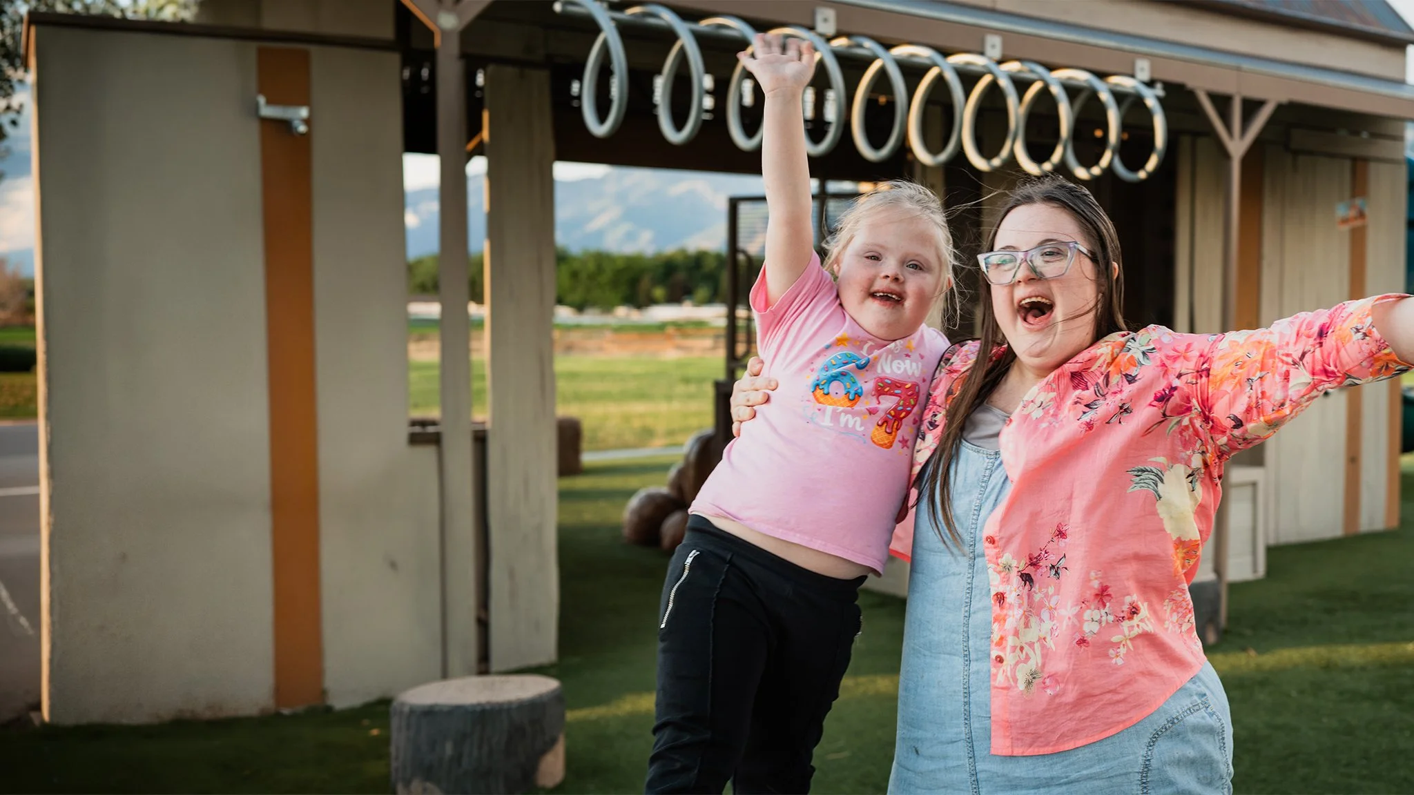 Two people with down syndrome celebrating