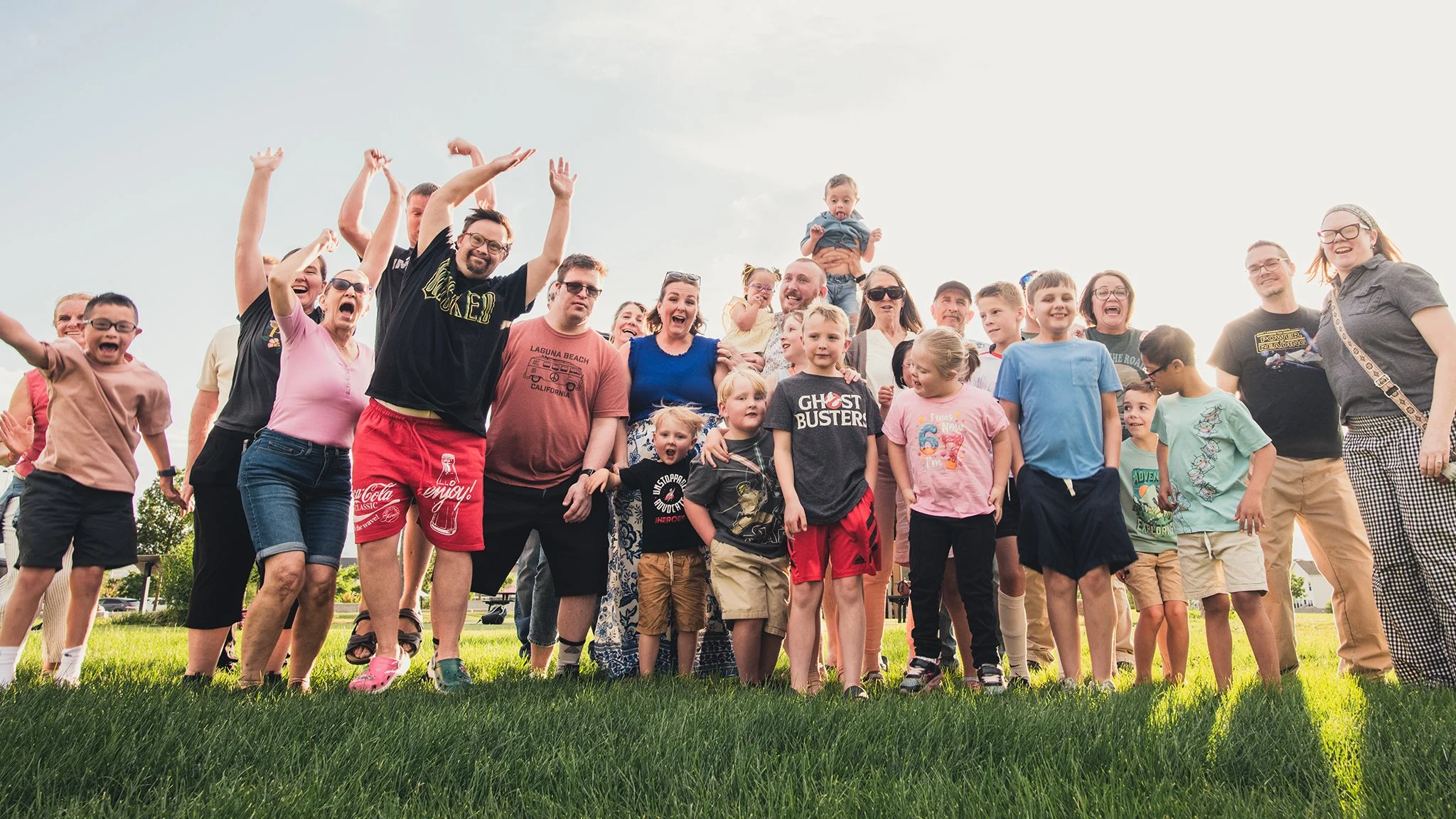 Individuals with Down syndrome surrounded by family and community