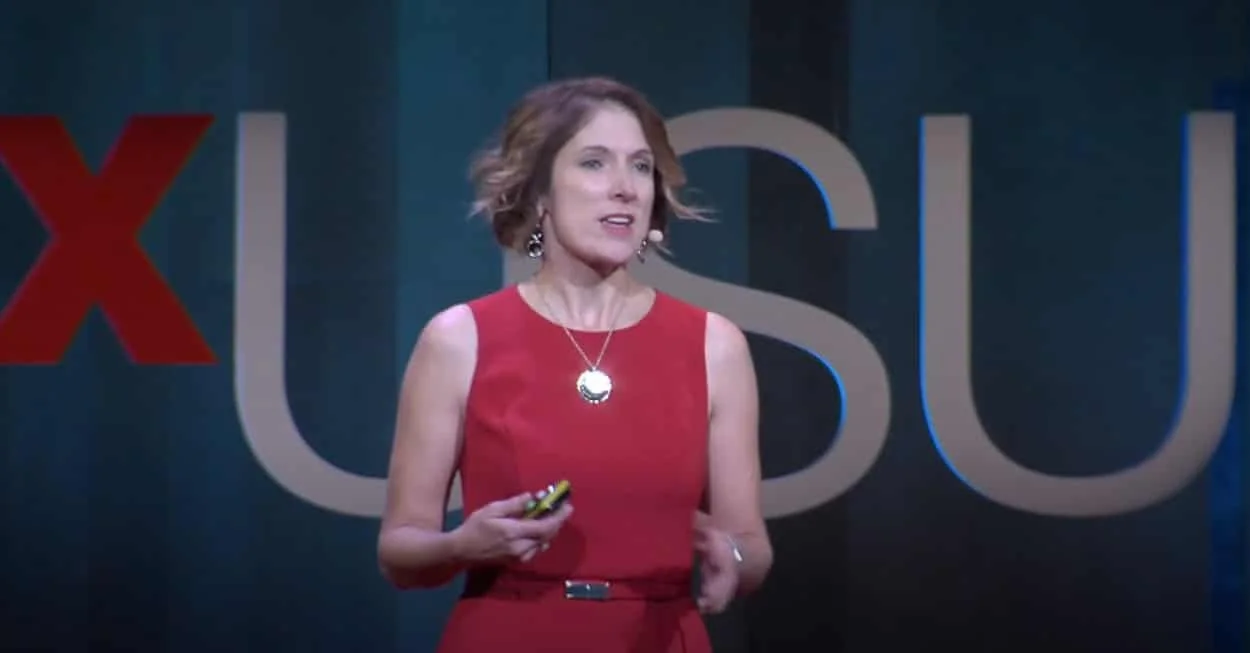 Merideth Thompson speaking on a TEDx stage