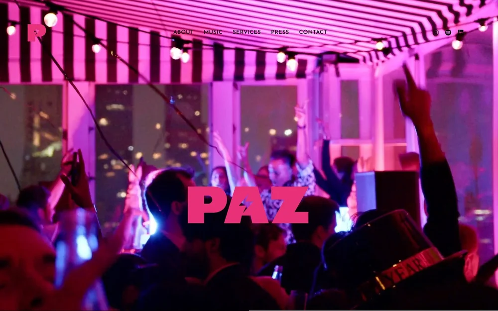 Paz Disco homepage: the pink PAZ wordmark over a crowd dancing under neon lights