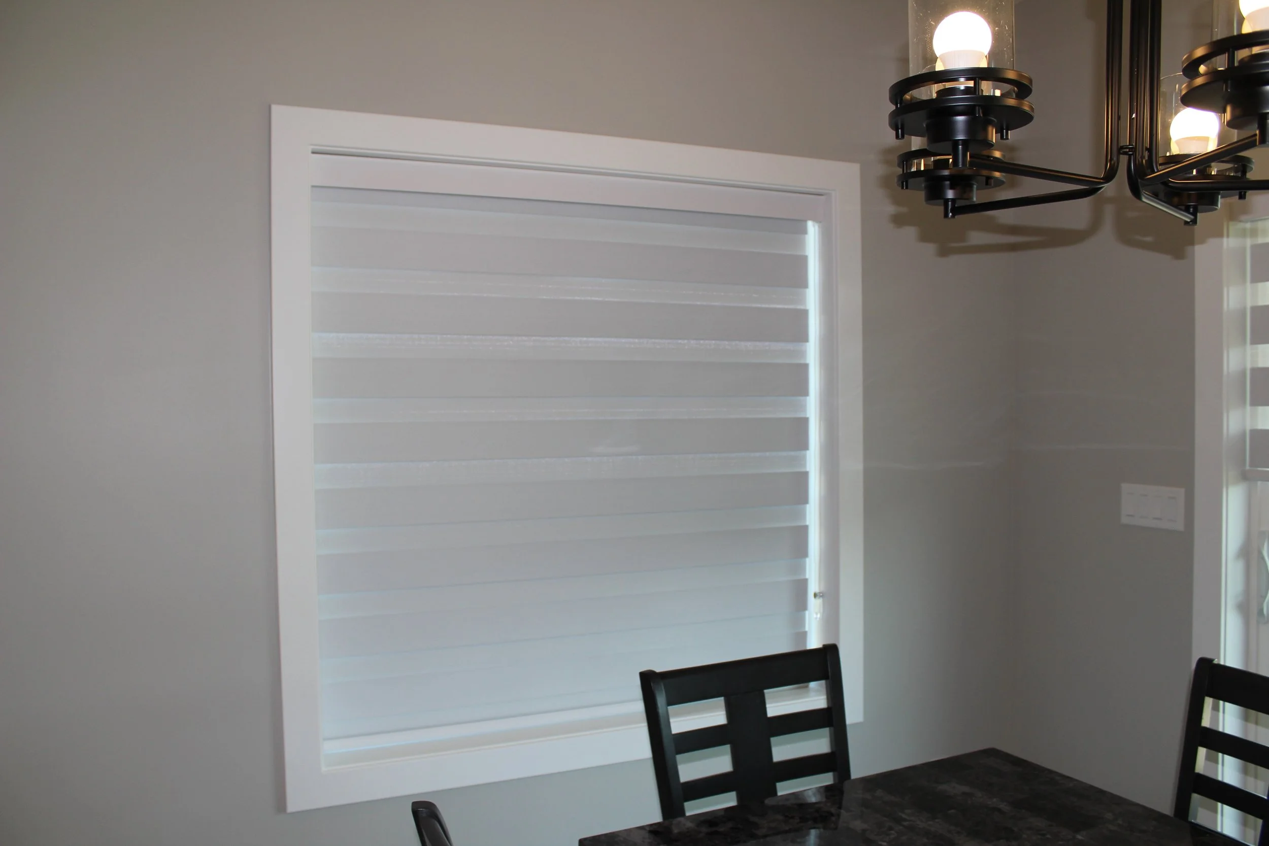 Soft layered Shangri-La style blinds in living room