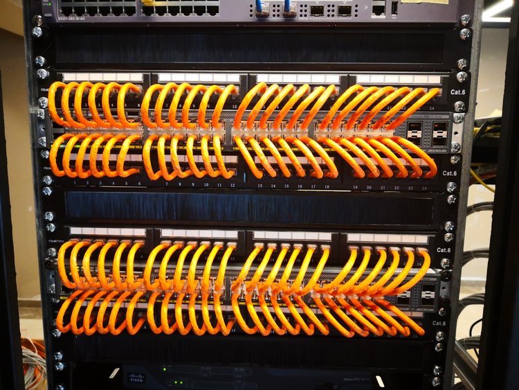 Cleanly installed Ethernet patch panel on network rack