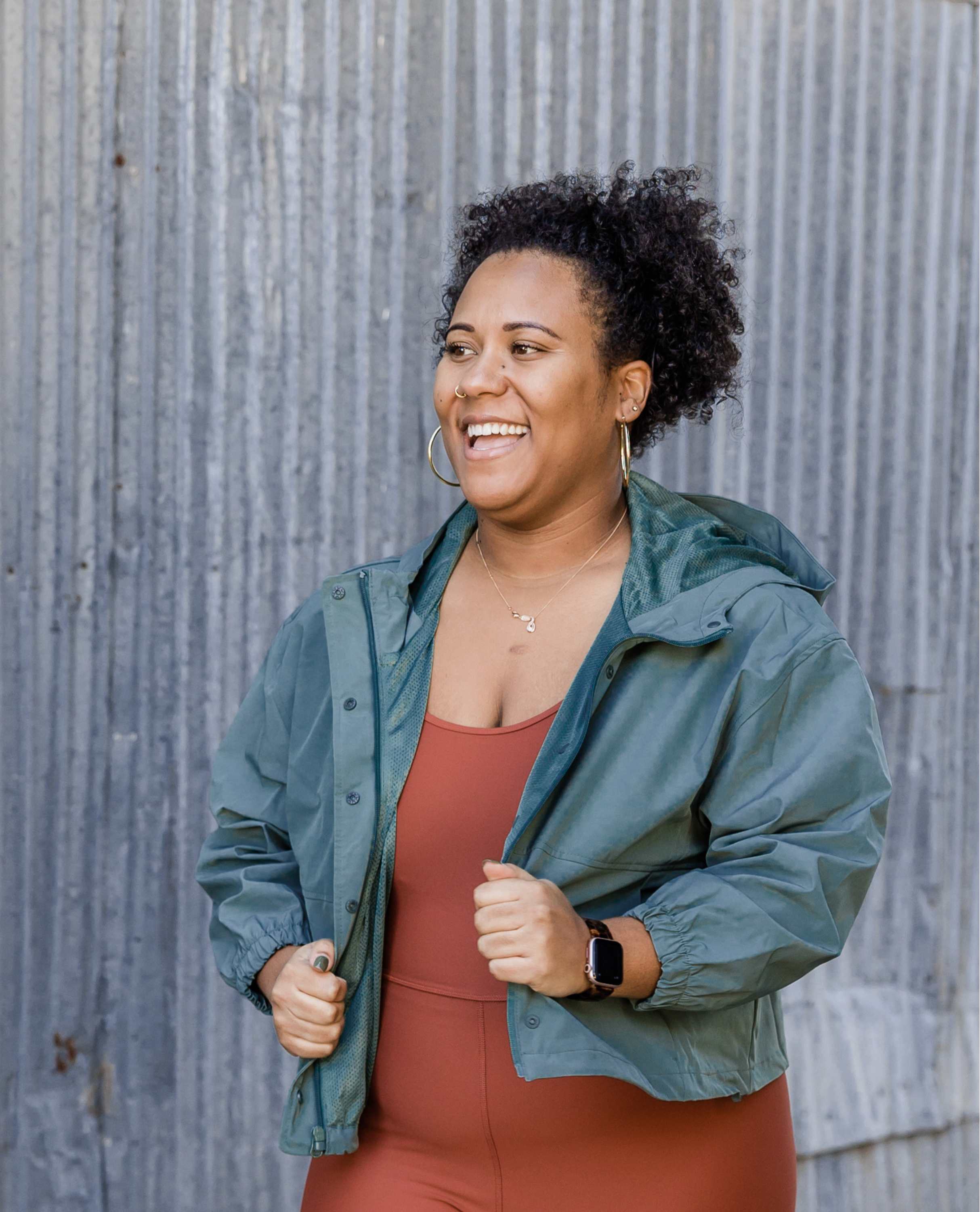 Woman smiling outdoors after weight loss journey