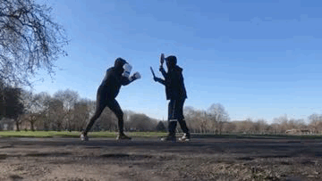 Boxing pad drill outdoors