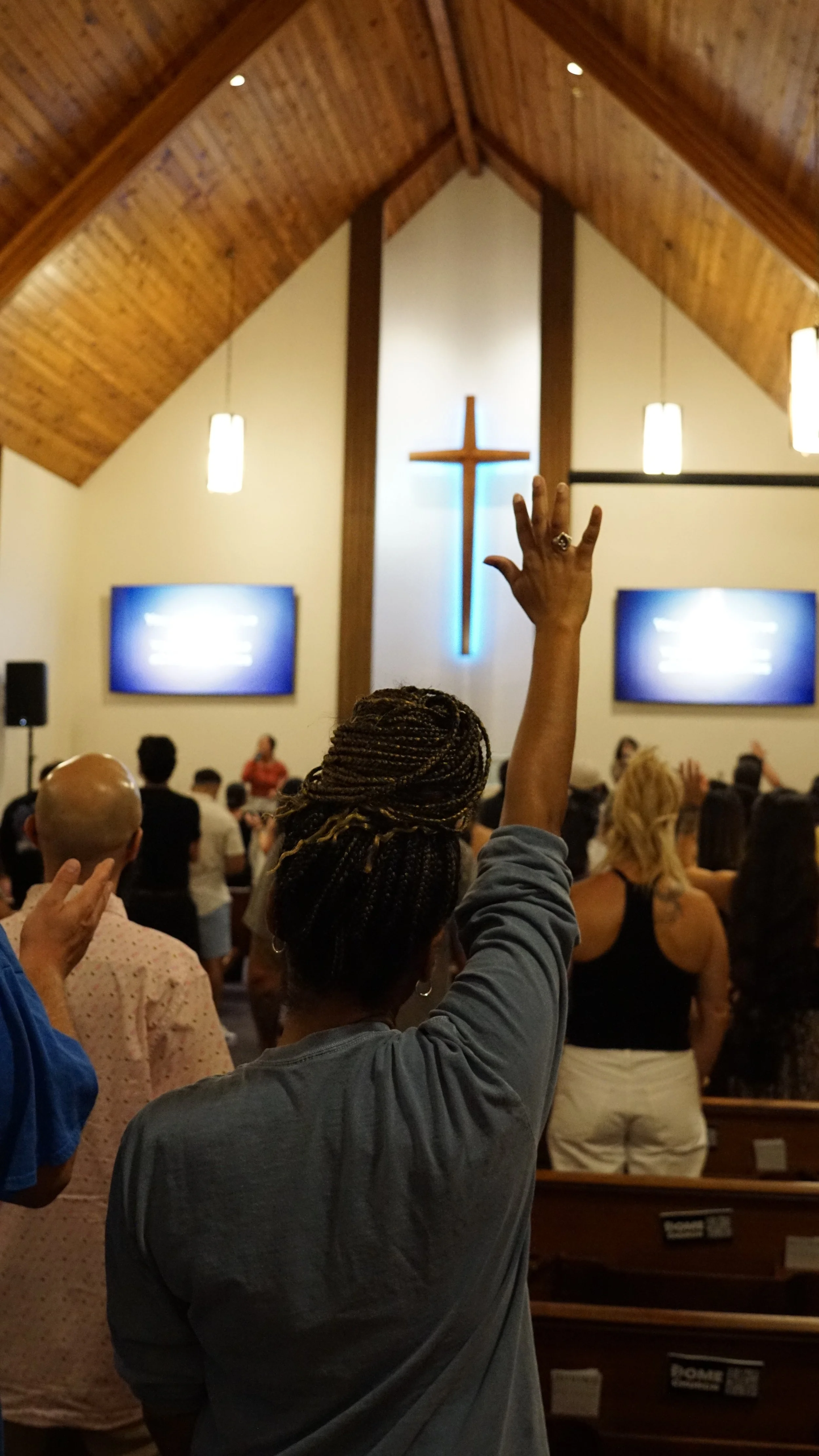 Worship at Home Church on October 4, 2026, with the congregation gathered before the cross.