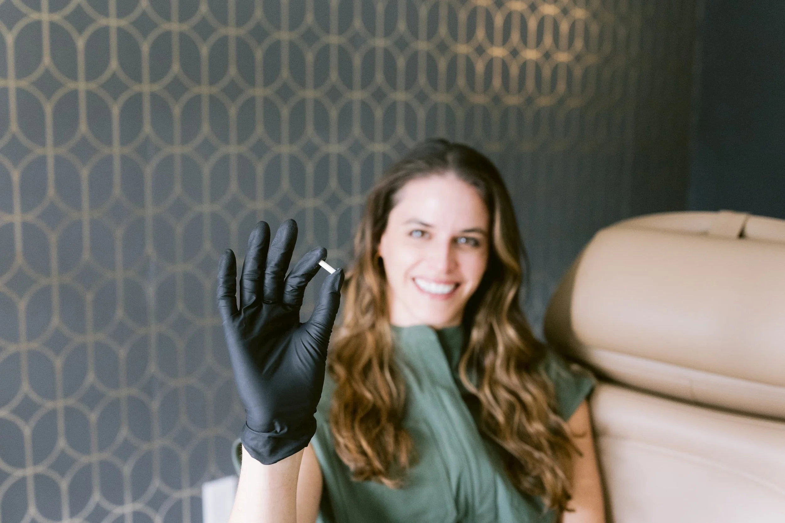 Gwen holding bioidentical hormone pellet at Alonso Aesthetics Tampa FL