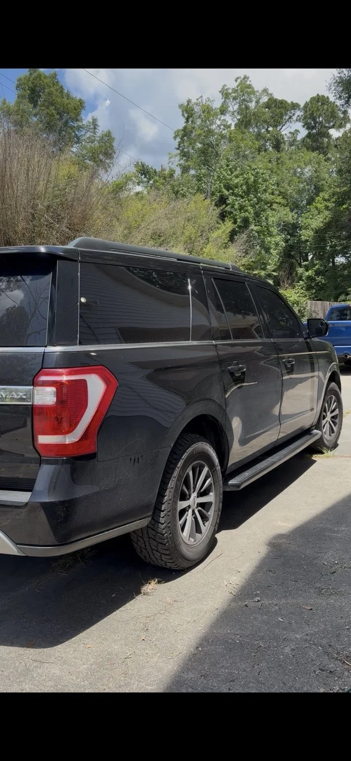 Black SUV before exterior detailing by Polish Patrol