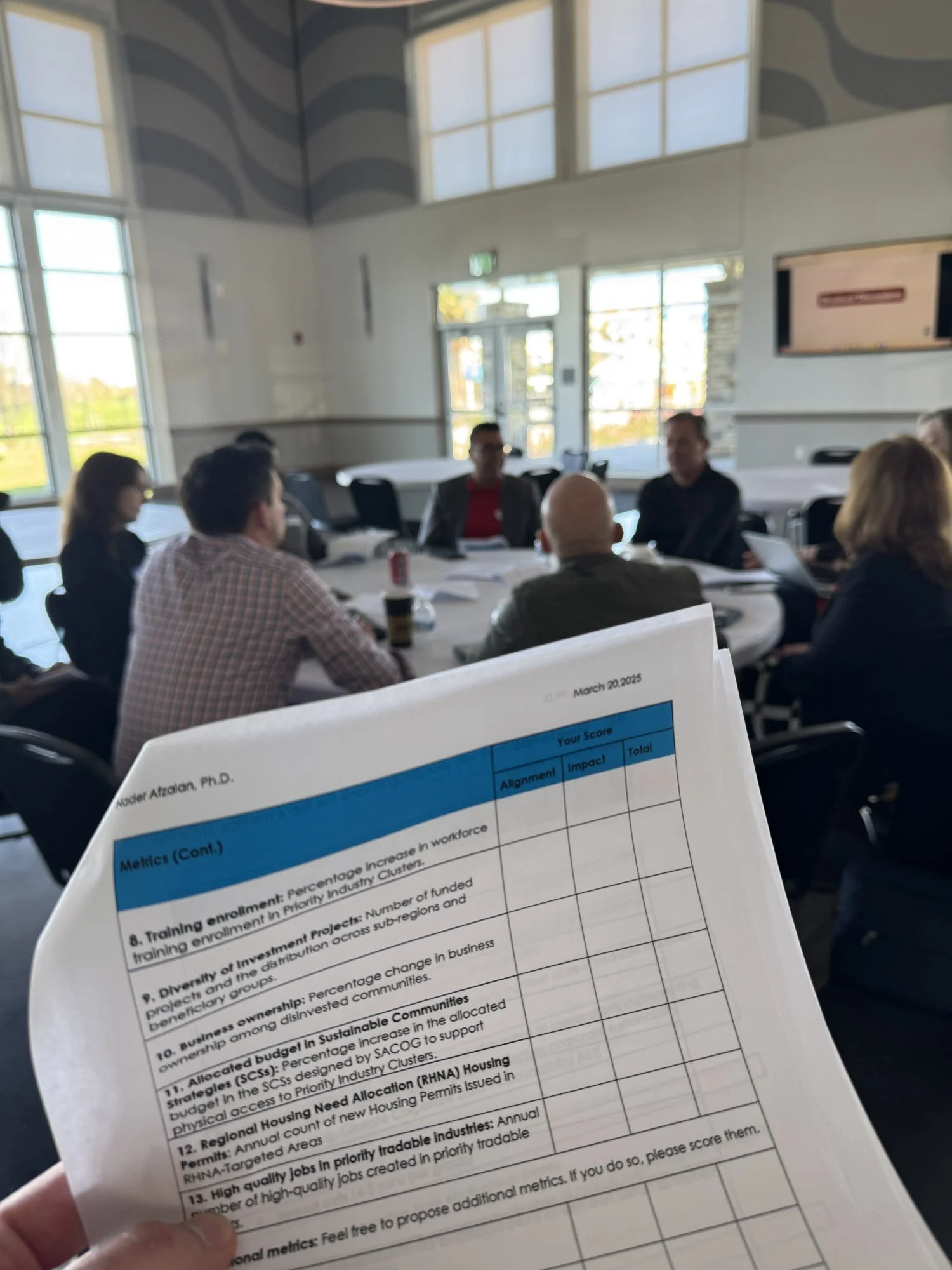 A scoring sheet held up during a partner learning session