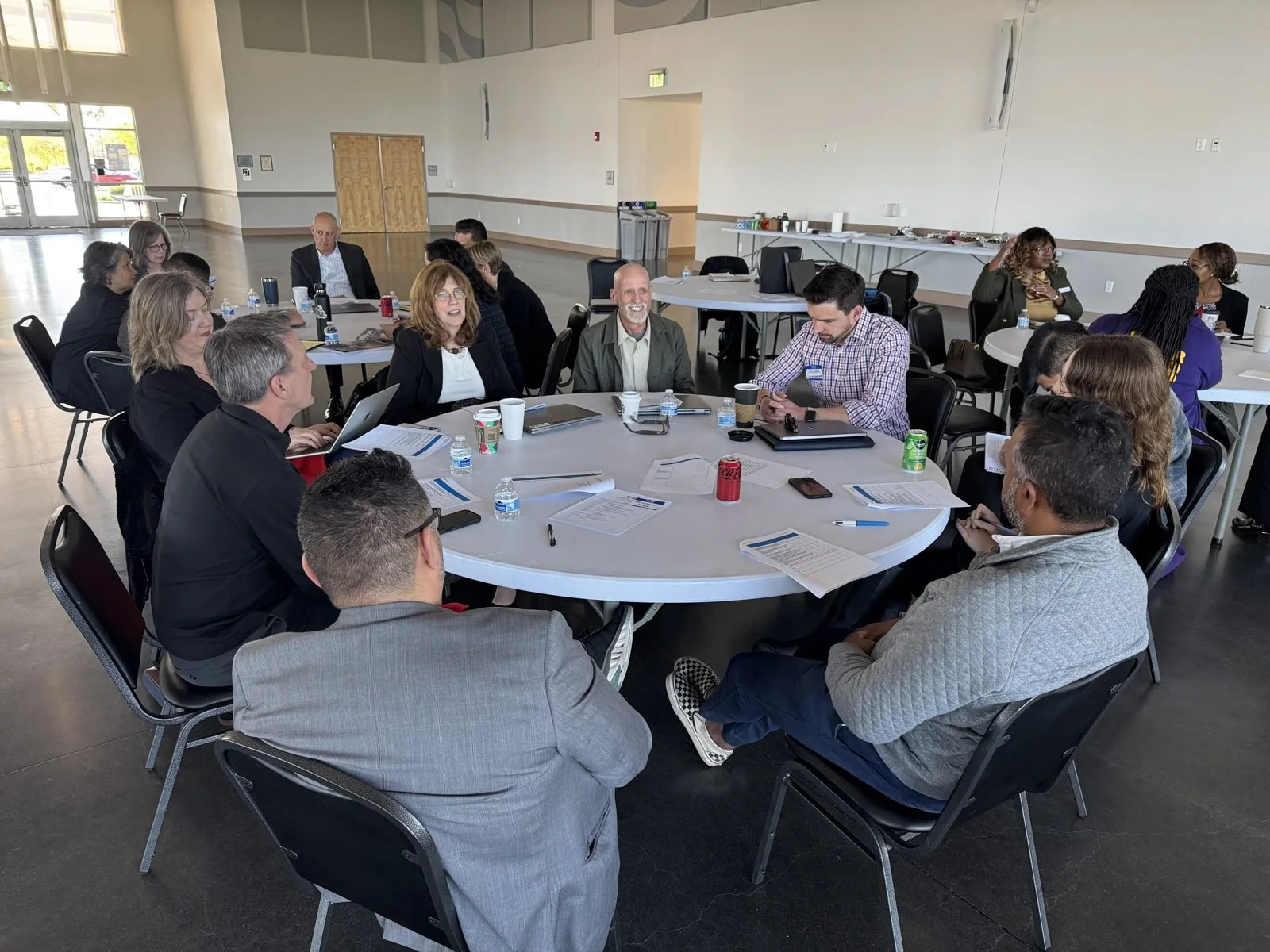Partners in discussion around a round table