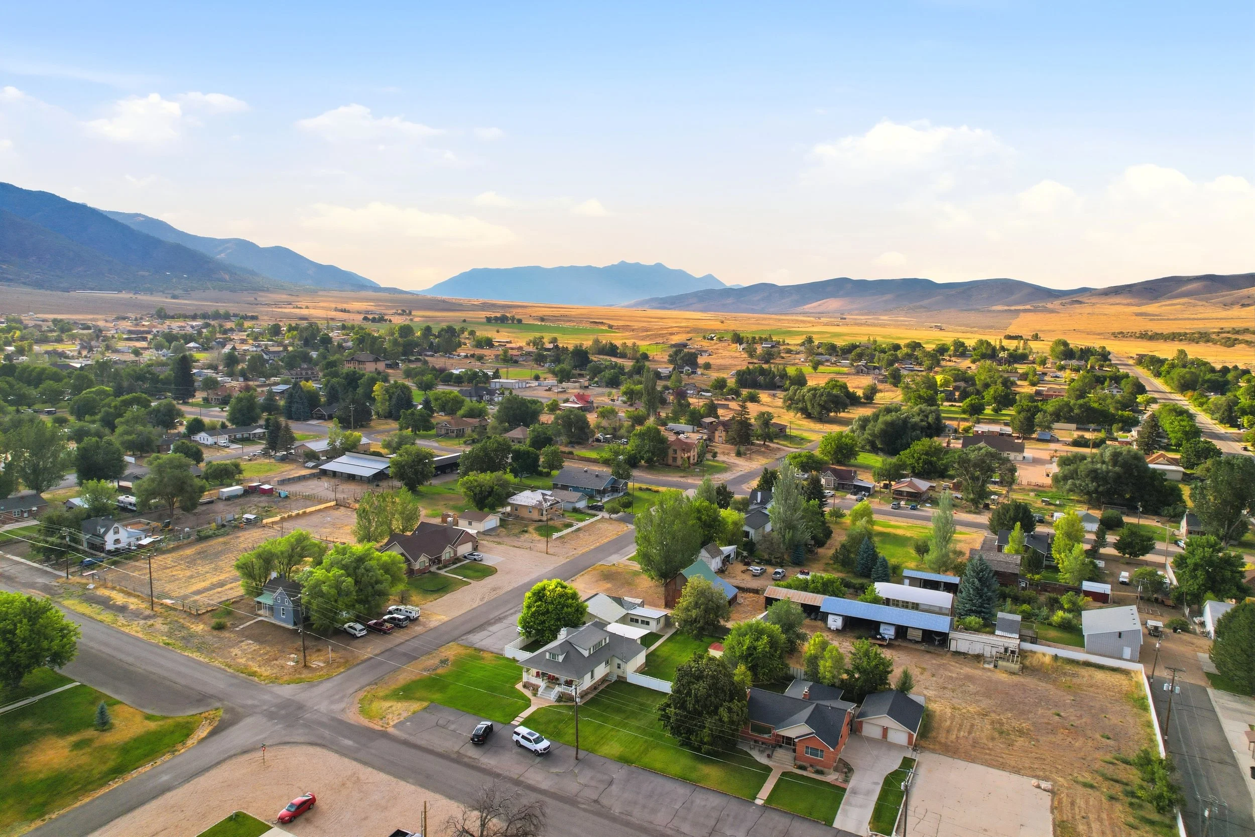 Aerial view across Fountain Green streets and residential blocks toward the Sanpete Valley