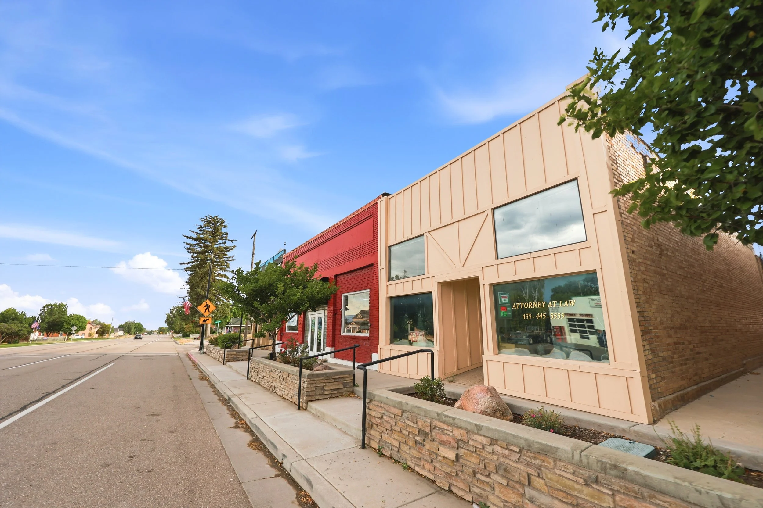 Street-level view of downtown Fountain Green along State Street with local storefronts and community buildings